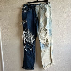 Distressed, half-bleached wrangler jeans